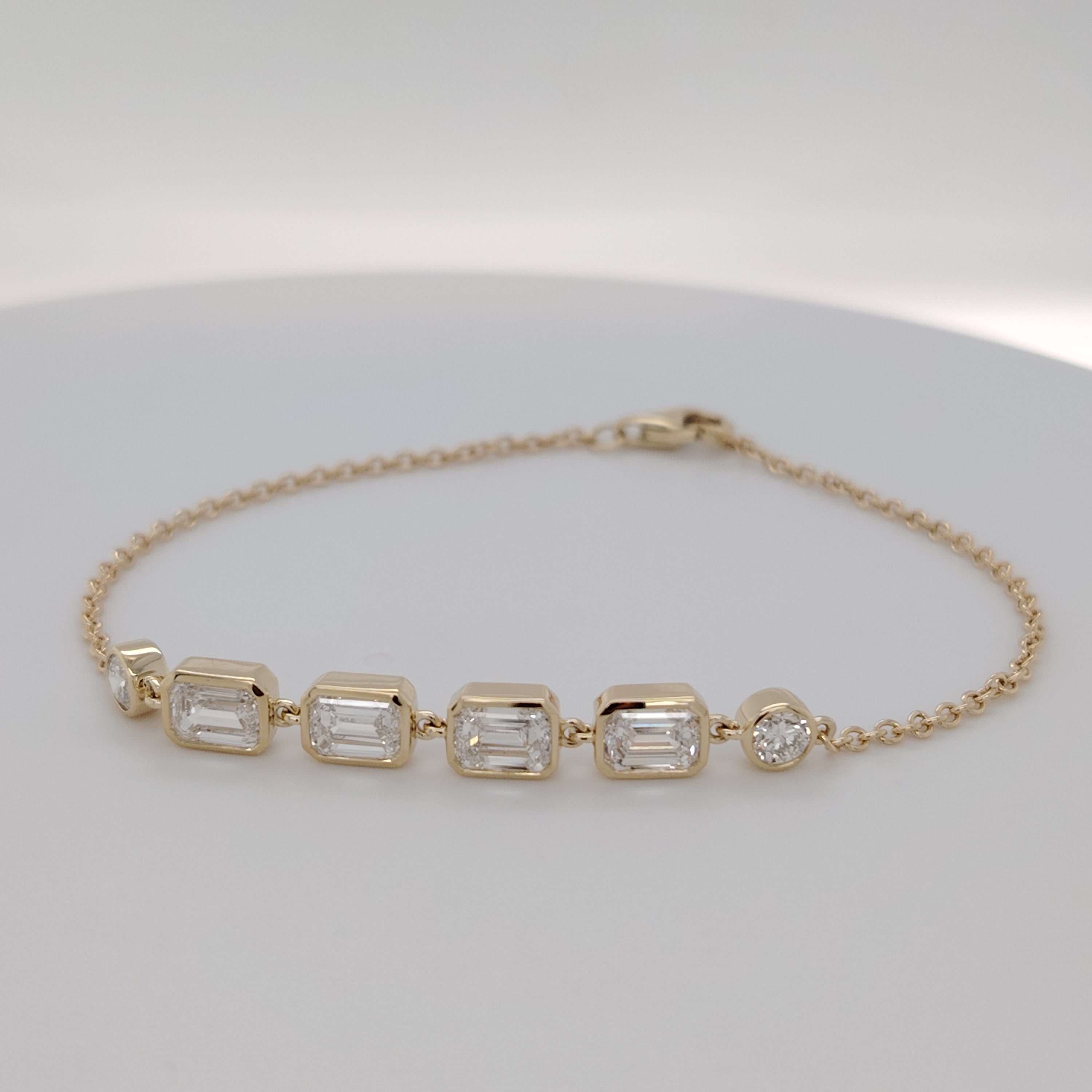 Bezel-Set Emerald Diamond Bracelet with Round Accents