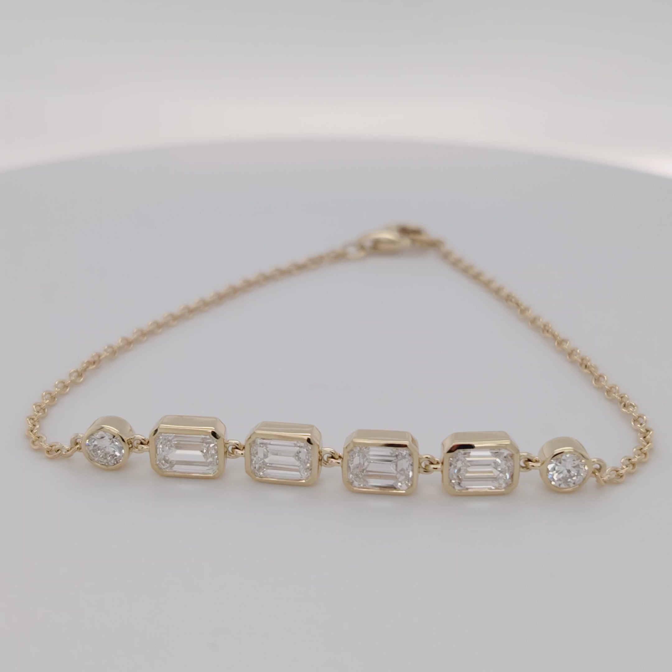 Bezel-Set Emerald Diamond Bracelet with Round Accents